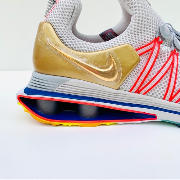 nike shox gravity metallic gold